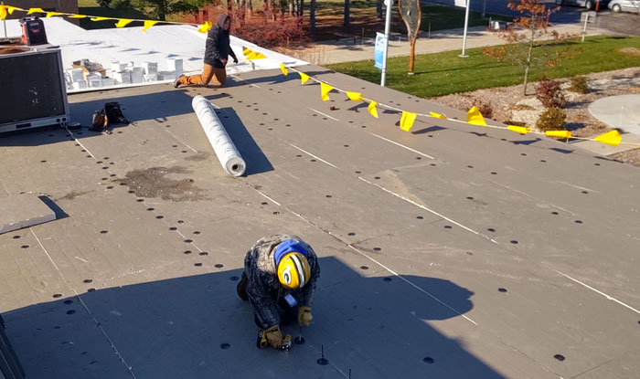 Man starting the Duro-Last Roof Installation